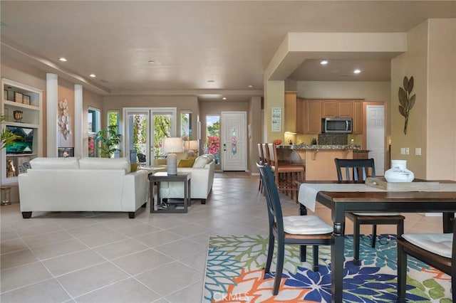 dining space with light tile patterned flooring