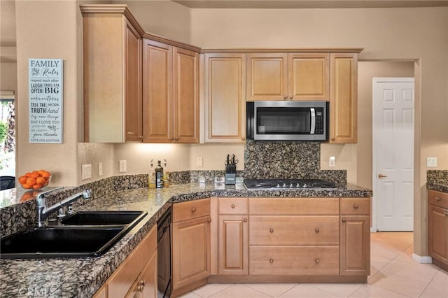 kitchen with light tile patterned floors, sink, dishwasher, tasteful backsplash, and gas stovetop