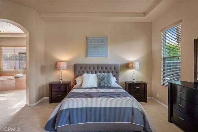 carpeted bedroom with ensuite bathroom