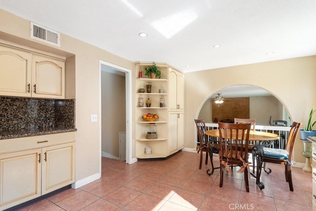 dining room with ceiling fan and light tile patterned flooring