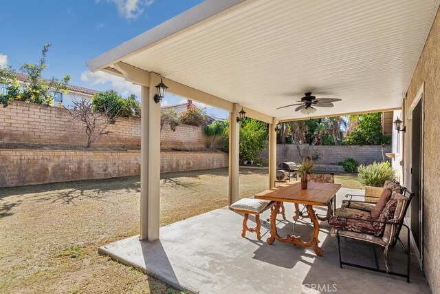 view of patio featuring ceiling fan