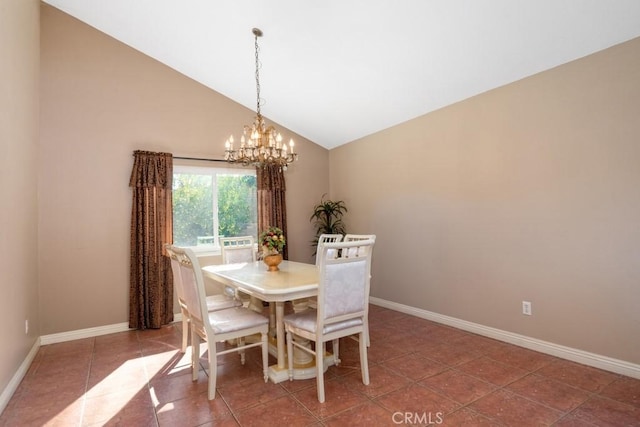 tiled dining area featuring a notable chandelier and vaulted ceiling