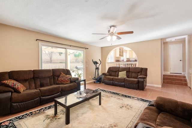 living room with light tile patterned floors and ceiling fan