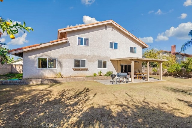 back of property with a patio area