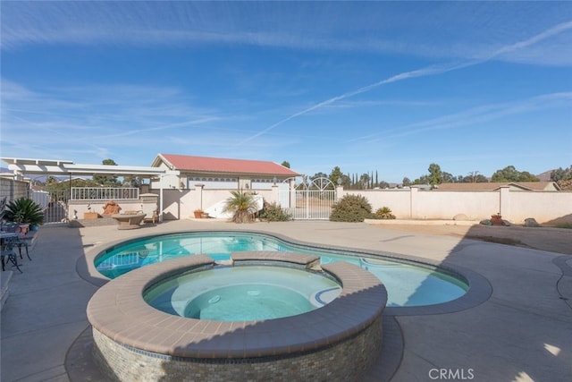 view of swimming pool with a patio area, a pool with connected hot tub, and a fenced backyard