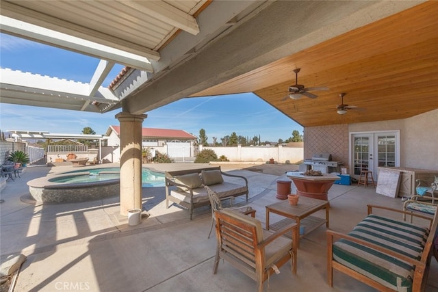 view of patio / terrace featuring a fenced in pool, a fenced backyard, an in ground hot tub, a grill, and an outdoor living space