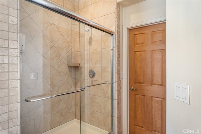 full bath featuring a tile shower