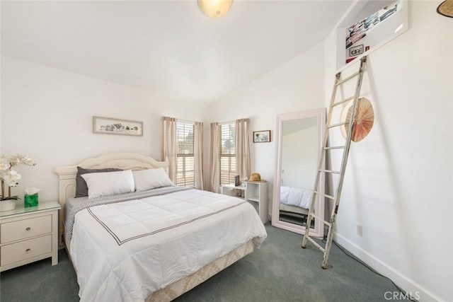 bedroom featuring vaulted ceiling, dark carpet, and baseboards