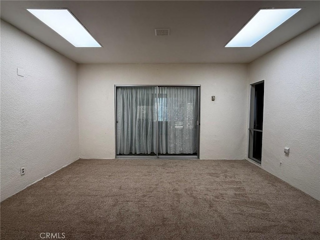 empty room featuring carpet floors