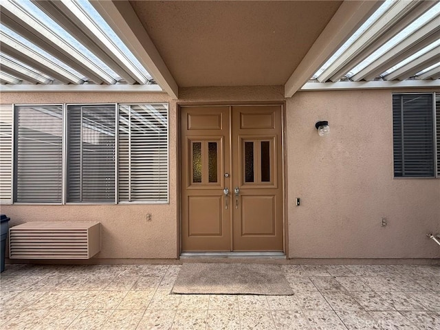 property entrance featuring french doors