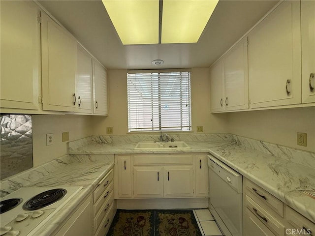 kitchen featuring white cabinetry, sink, white appliances, and tile patterned flooring