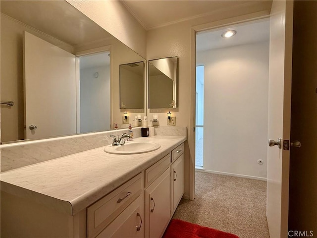 bathroom featuring vanity and ornamental molding