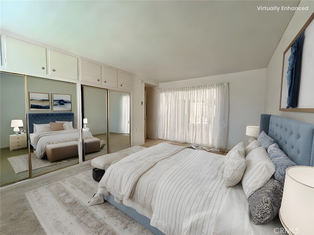 bedroom with light colored carpet