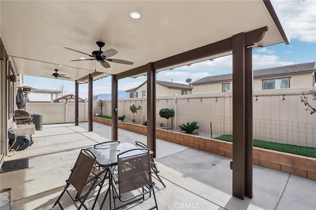 view of patio / terrace featuring ceiling fan and central air condition unit