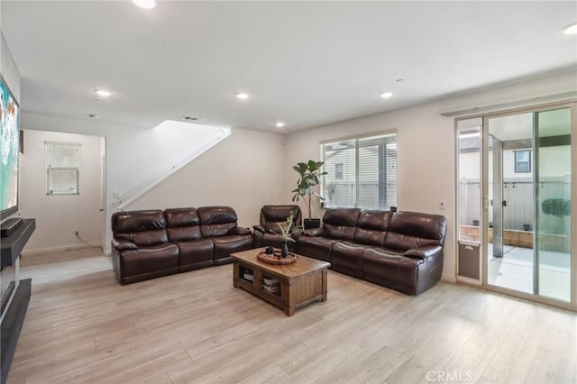 living room with light hardwood / wood-style floors