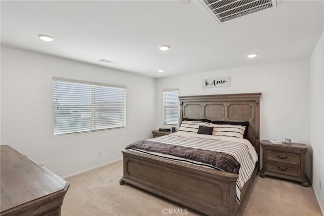 bedroom featuring light colored carpet