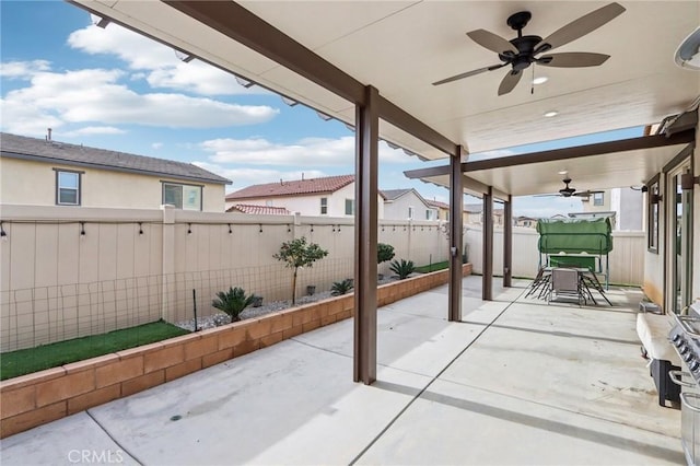 view of patio featuring ceiling fan