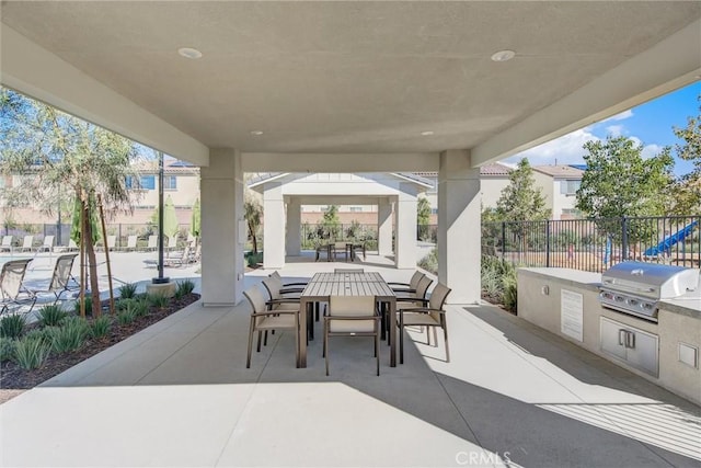 view of patio with a grill and an outdoor kitchen