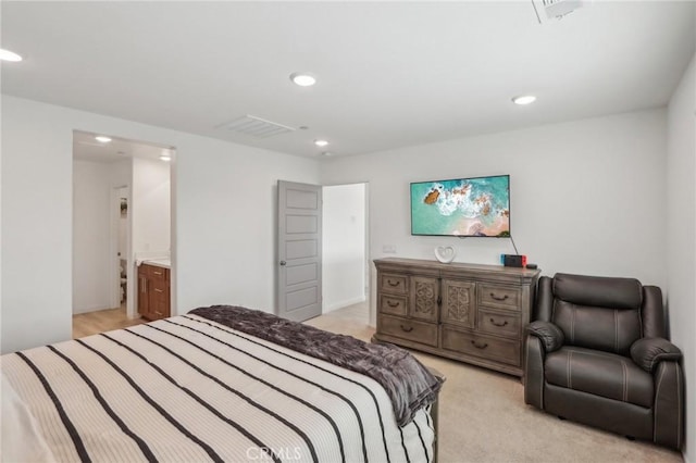 carpeted bedroom featuring connected bathroom