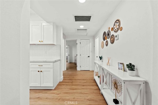 hallway with light wood-type flooring