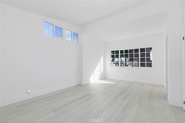 unfurnished room with light hardwood / wood-style floors