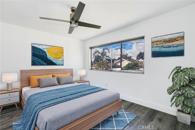 bedroom featuring ceiling fan and dark wood-type flooring