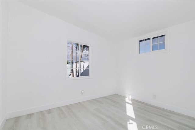 unfurnished room with light hardwood / wood-style floors