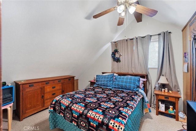 bedroom with ceiling fan, light colored carpet, and vaulted ceiling