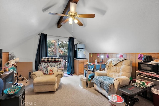 interior space with light colored carpet, wood walls, and vaulted ceiling with beams