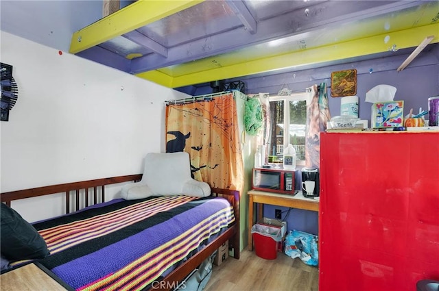 bedroom featuring hardwood / wood-style floors