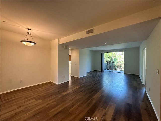 unfurnished room featuring dark hardwood / wood-style floors