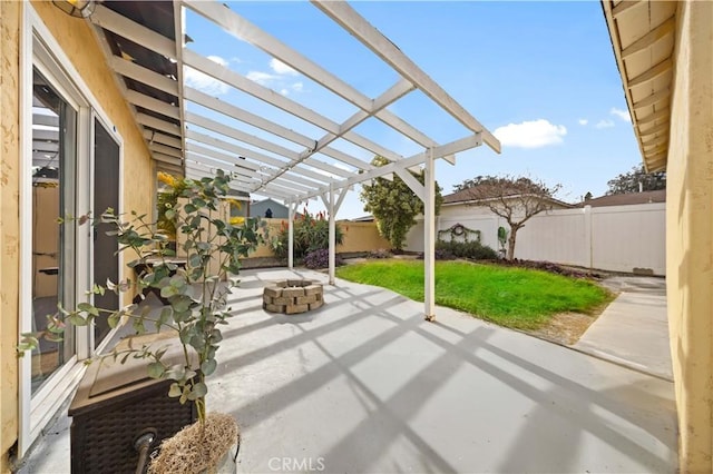 view of patio / terrace featuring an outdoor fire pit and a pergola