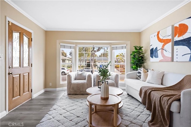 sitting room featuring hardwood / wood-style flooring and ornamental molding