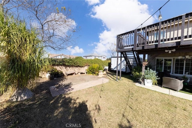 view of yard with a wooden deck