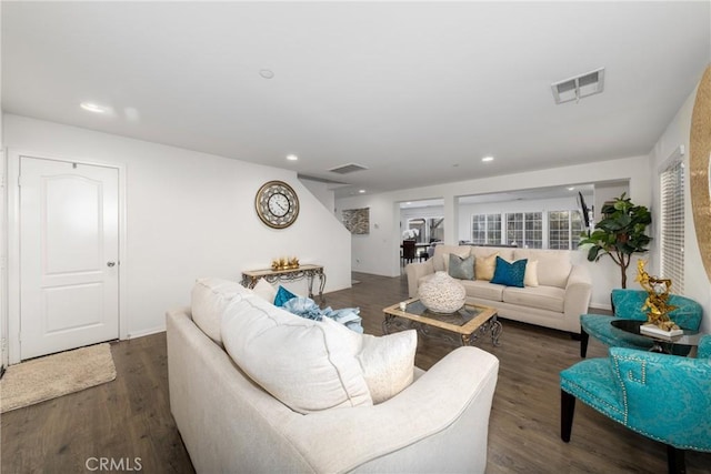 living room with dark hardwood / wood-style floors