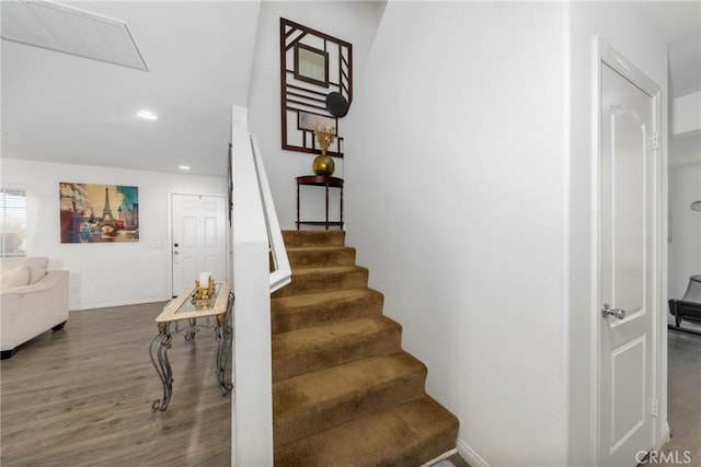 stairs with hardwood / wood-style flooring