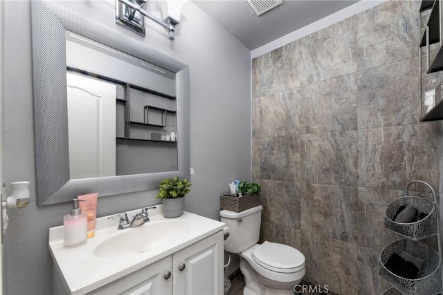 bathroom with vanity and toilet