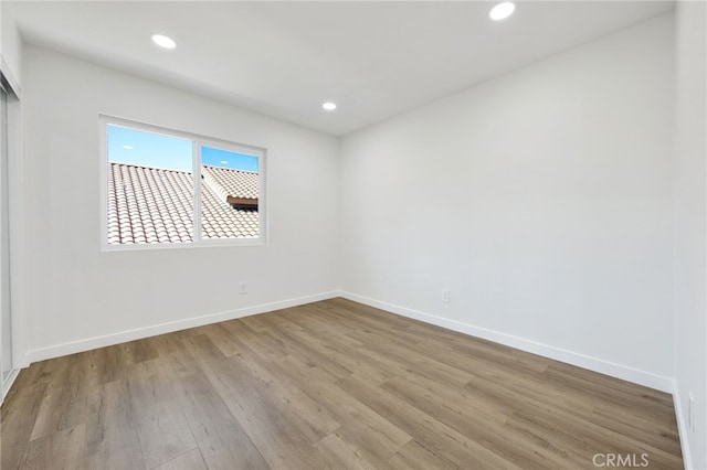 unfurnished room featuring light hardwood / wood-style floors