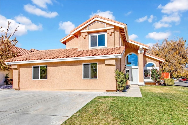 rear view of property featuring a yard