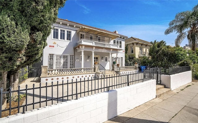 view of front of home with a balcony and a porch