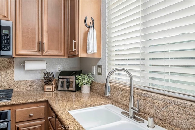 kitchen with sink and a wealth of natural light