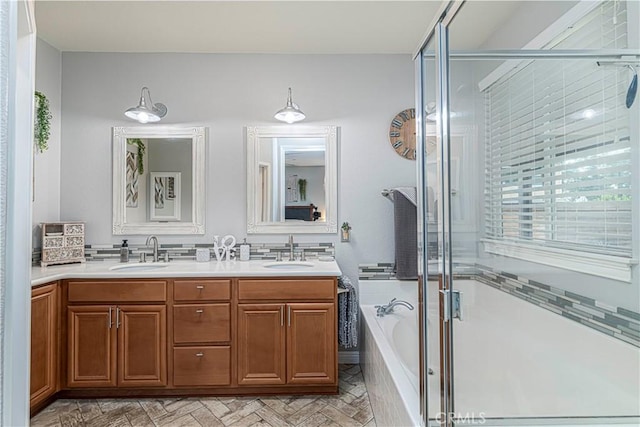 bathroom with independent shower and bath and vanity