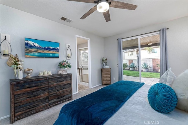 carpeted bedroom with access to exterior, ceiling fan, and ensuite bath