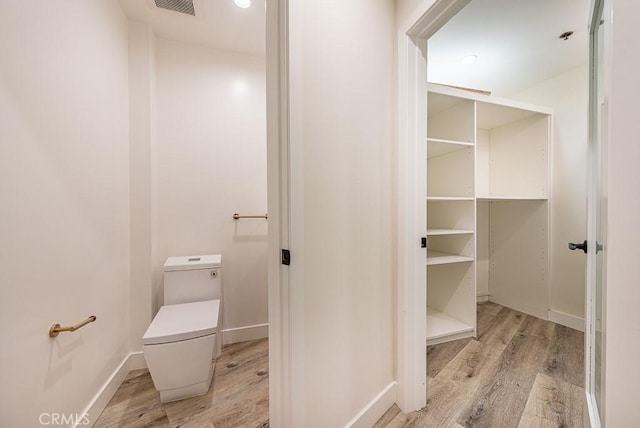 bathroom with wood-type flooring