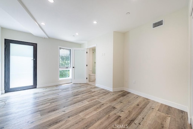 empty room with light wood-type flooring