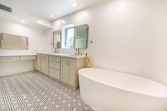 bathroom with vanity and a bath