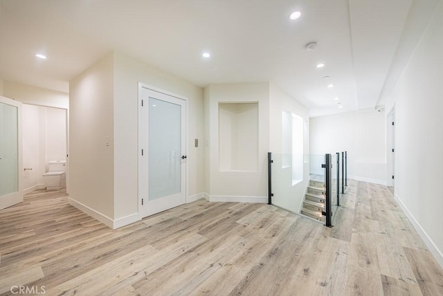 hallway with light wood-type flooring