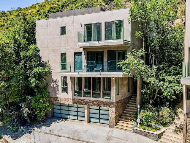 contemporary home featuring a balcony