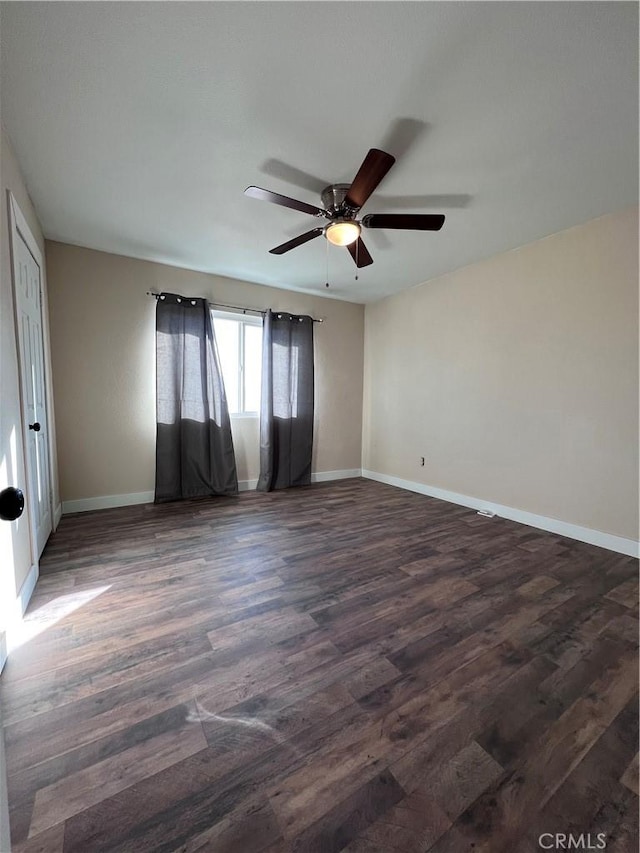 unfurnished room featuring dark hardwood / wood-style floors and ceiling fan