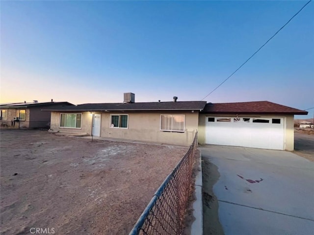 single story home featuring a garage